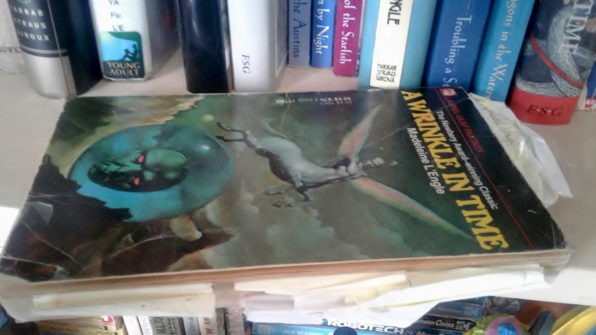 Well-worn Dell Laurel-Leaf edition of 'A Wrinkle In Time', dozens of sticky-note bookmarks protruding all around the edges