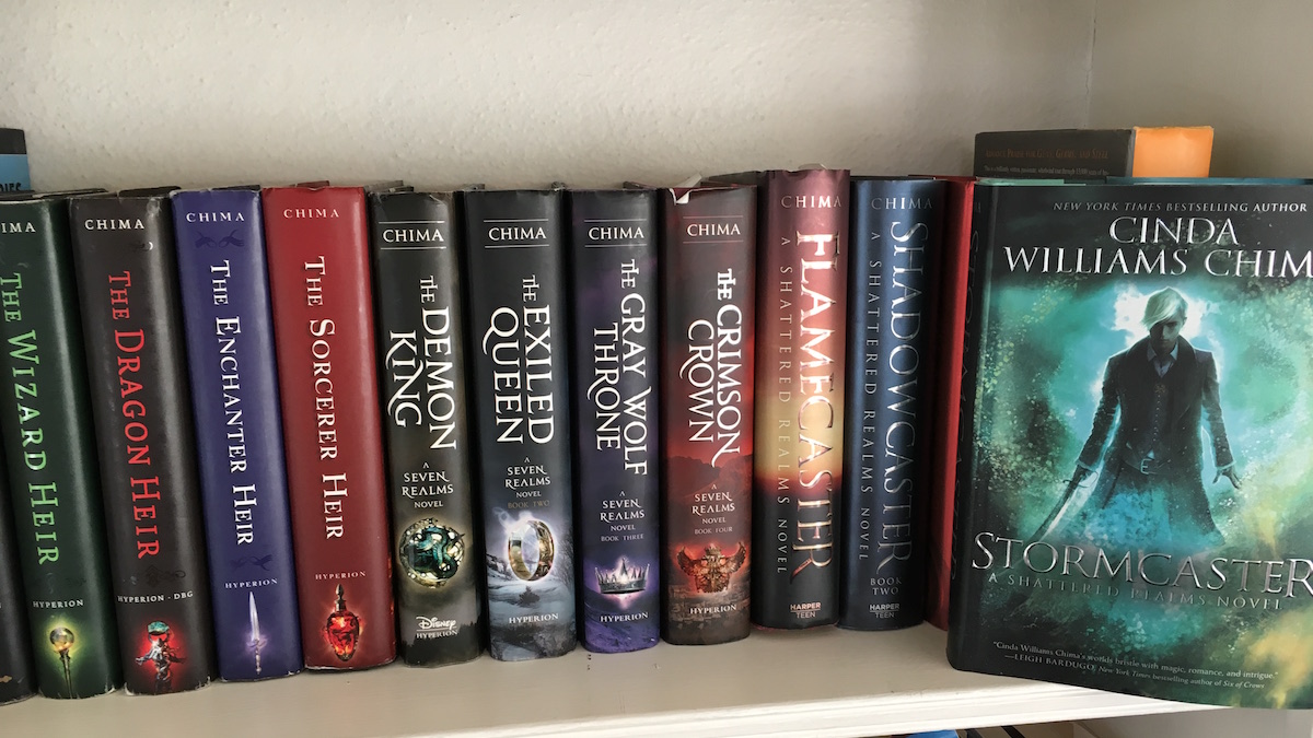 bookshelf display of all Cinda Williams Chima's books, ending with Stormcaster