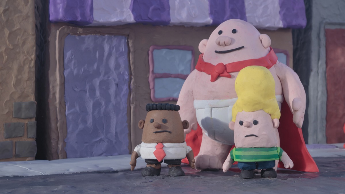 Still from 'The Epic Tales of Captain Underpants' showing clay figures of George, Captain Underpants, and Harold, the boys frowning.