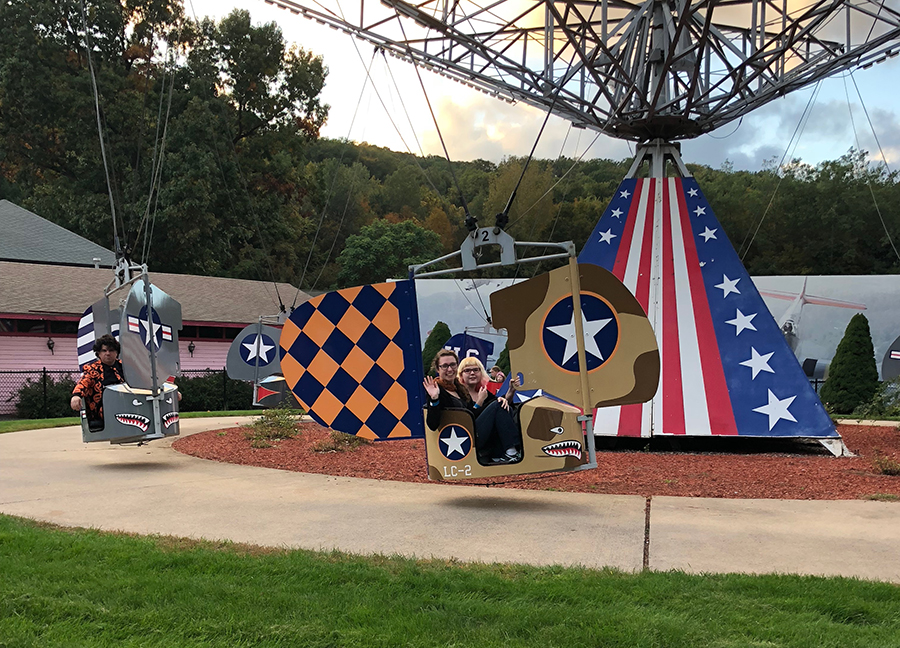 a photo of the authors children on the "American Flyers" ride
