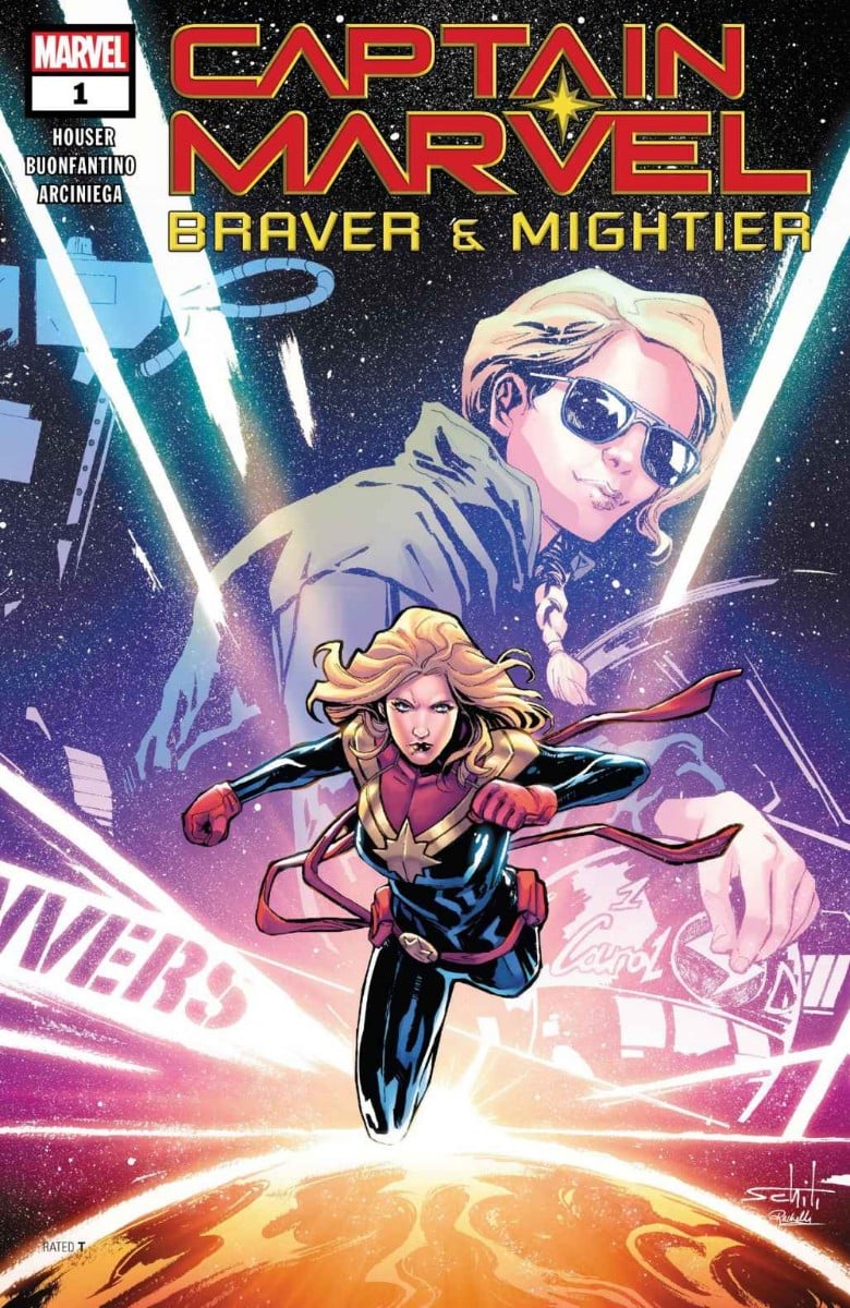 Carol Danvers in the background in a pilot uniform, in the foreground as Captain Marvel.