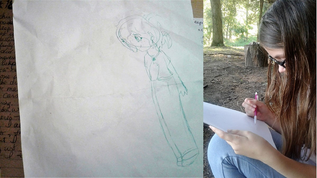 A bit of journaling behind a sheet of paper with a person doodled on it; a girl drawing said doodle