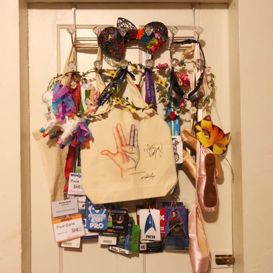 tote bag with art by Malissa and signed by Aron and Malissa hanging in the author's bedroom