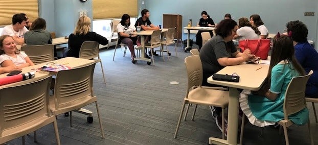 small groups gathered at tables