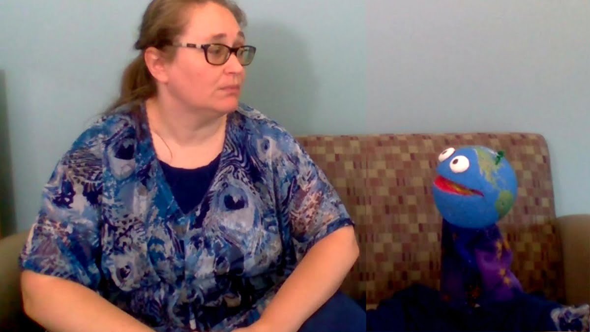 The author listening intently to aforementioned Earth puppet